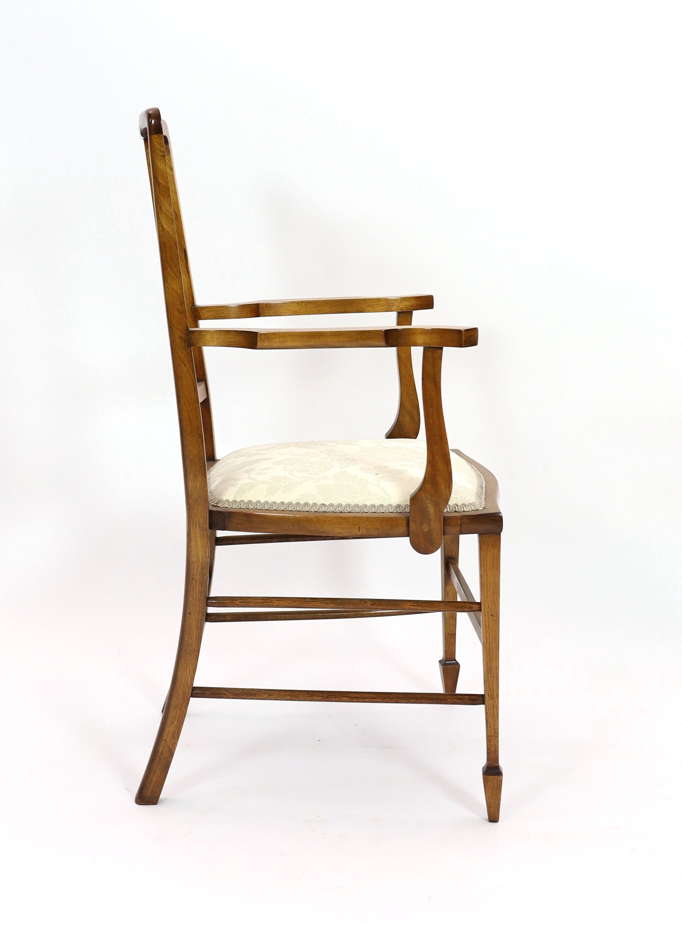 An Edwardian inlaid mahogany elbow chair, width 51cm depth 45cm height 96cm, and two Edwardian dining chairs
